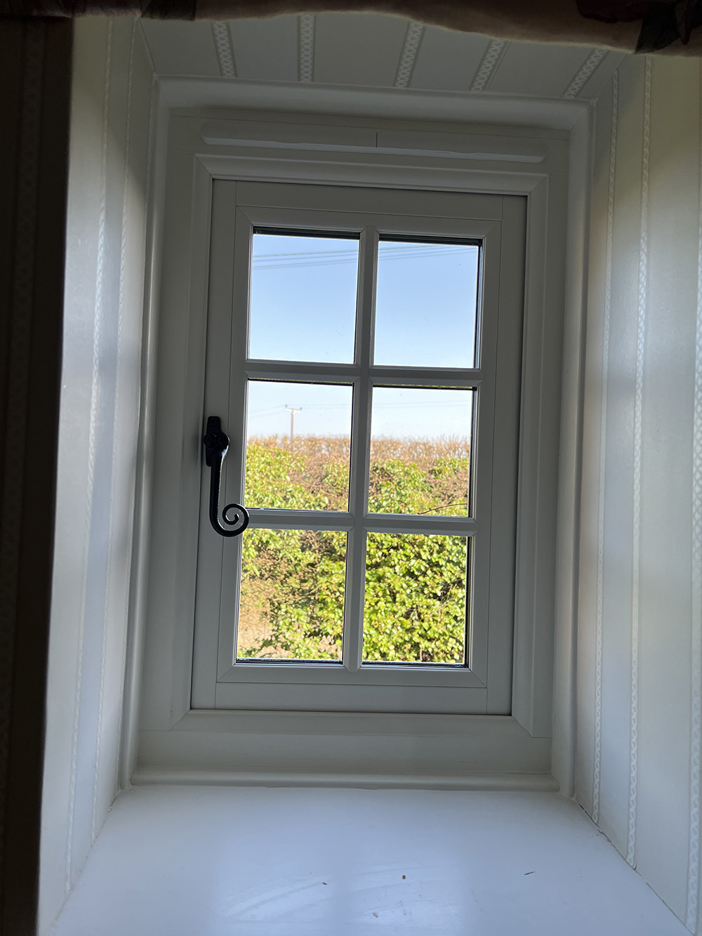 Interior of flush sash window with monkey tail handle