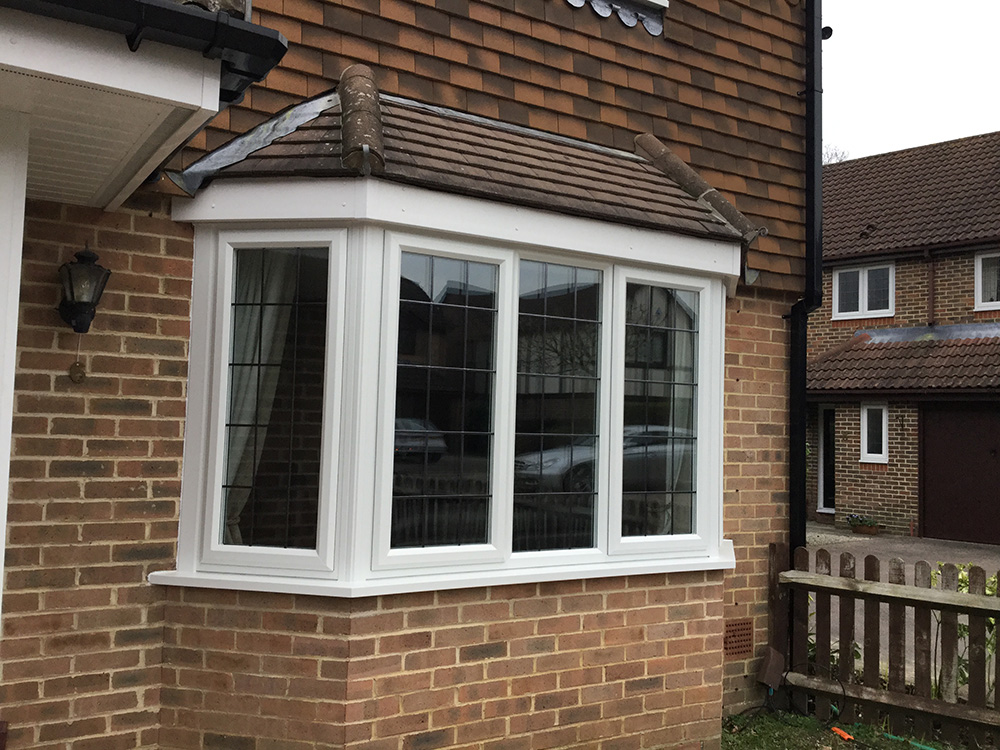 Triple glazed bay window with square leads