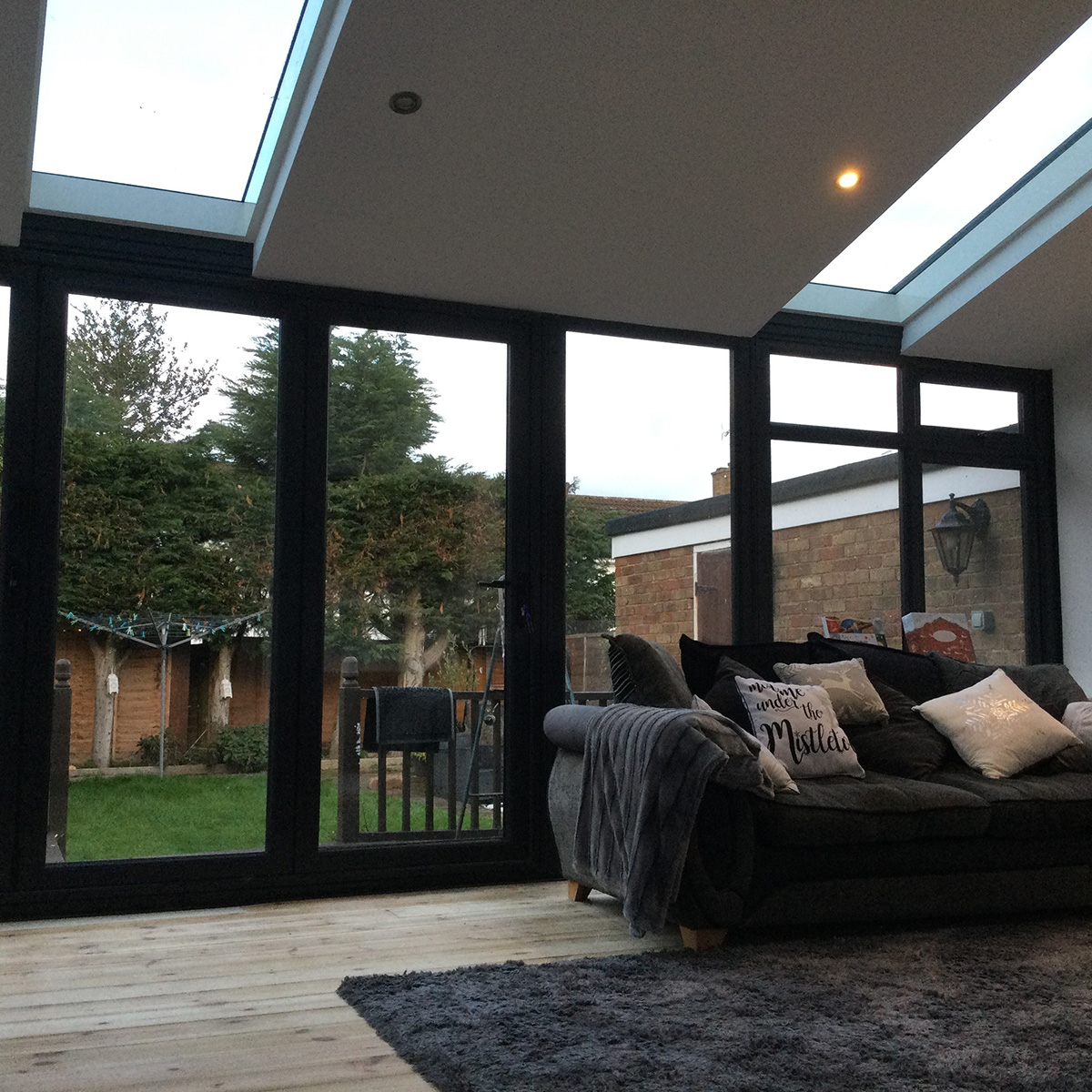 Conservatory with SupaLite Roof and anthracite windows and doors and SkyVista glass panels in roof 1 Facelift